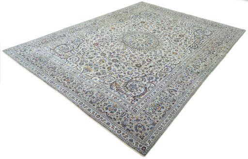 Corner detail of 2000s Kashan rug showing border pattern and Cork pile