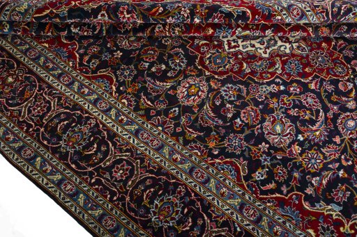 Close-up detail of 2000s Kashan rug from Iran / Persia showing Wool weave