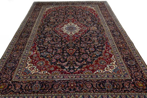 Surface texture of 2000s Kashan rug with natural Wool and intricate pattern