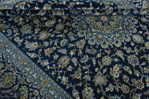 Close-up detail of 2000s Kashan rug from Iran / Persia showing Wool weave