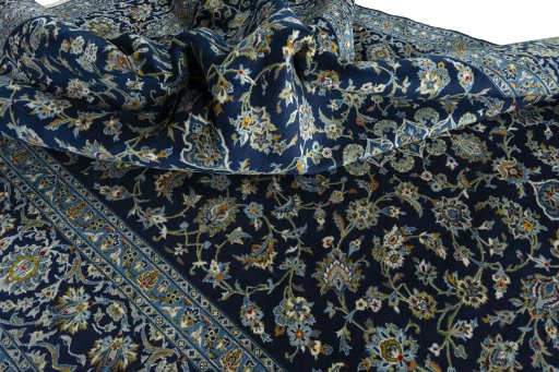 Surface texture of 2000s Kashan rug with natural Wool and intricate pattern