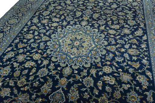 Backside of handmade 2000s Kashan rug showing knot structure and weave density