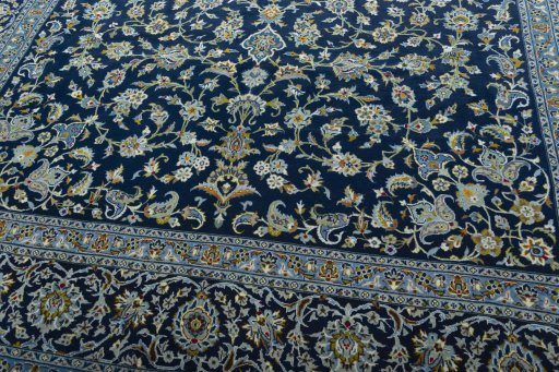 Close-up detail of 2000s Kashan rug from Iran / Persia showing Wool weave