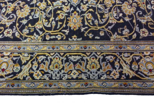 Corner detail of 1970s Kashan rug showing border pattern and Wool pile