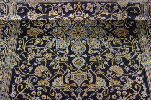 Close-up detail of 1970s Kashan rug from Iran / Persia showing Wool weave