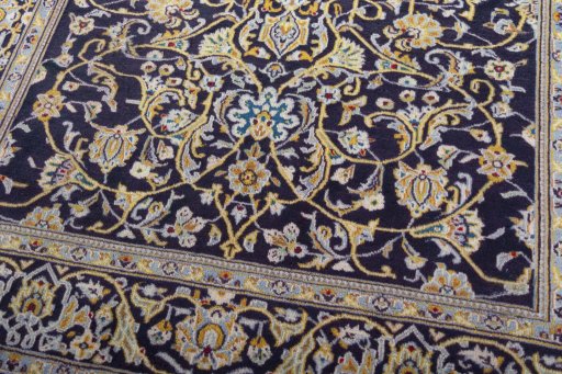 Close-up detail of 1970s Kashan rug from Iran / Persia showing Wool weave