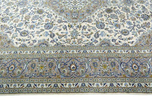Corner detail of 2000s Kashan rug showing border pattern and Wool pile