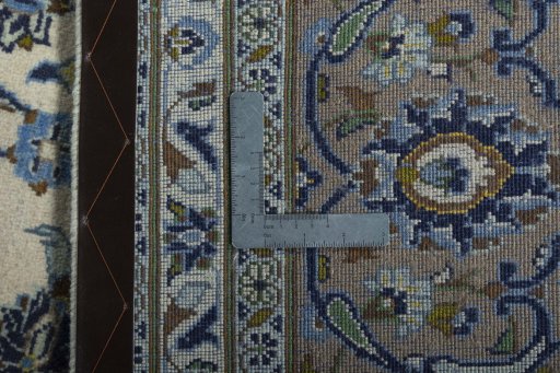 Backside of handmade 2000s Kashan rug showing knot structure and weave density