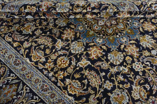 Close-up detail of 2000s Kashan rug from Iran / Persia showing Wool weave