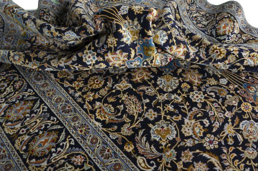 Surface texture of 2000s Kashan rug with natural Wool and intricate pattern