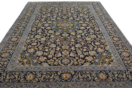 Surface texture of 2000s Kashan rug with natural Wool and intricate pattern