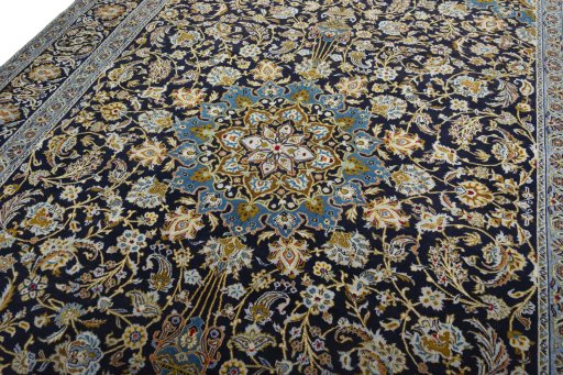 Backside of handmade 2000s Kashan rug showing knot structure and weave density