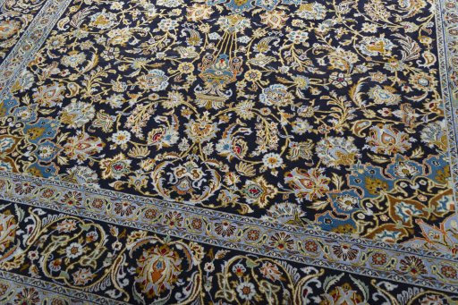 Close-up detail of 2000s Kashan rug from Iran / Persia showing Wool weave