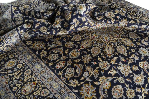 Surface texture of 2000s Kashan rug with natural Wool and intricate pattern