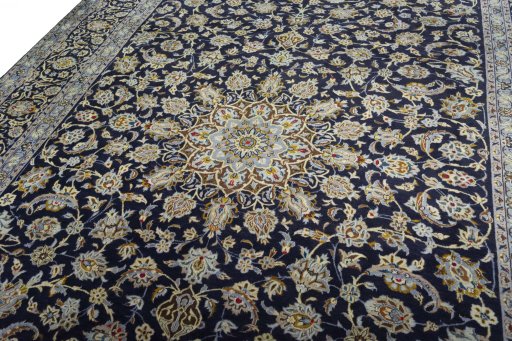 Backside of handmade 2000s Kashan rug showing knot structure and weave density