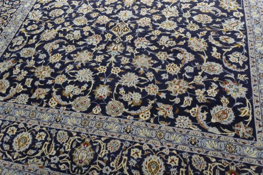 Close-up detail of 2000s Kashan rug from Iran / Persia showing Wool weave