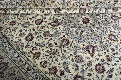 Close-up detail of 2000s Kashan rug from Iran / Persia showing Wool weave