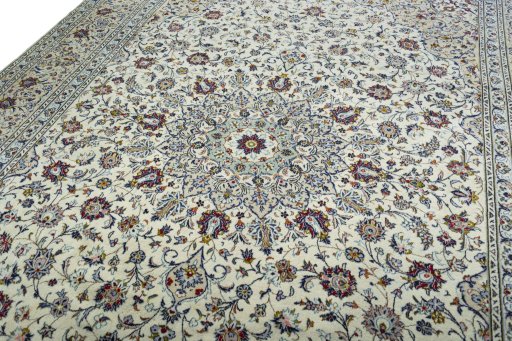 Backside of handmade 2000s Kashan rug showing knot structure and weave density