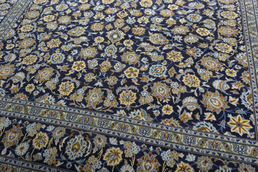 Close-up detail of 2000s Kashan rug from Iran / Persia showing Wool weave