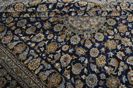 Close-up detail of 2000s Kashan rug from Iran / Persia showing Wool weave