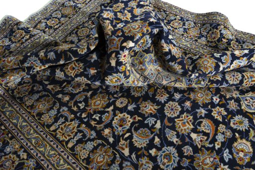 Surface texture of 2000s Kashan rug with natural Wool and intricate pattern