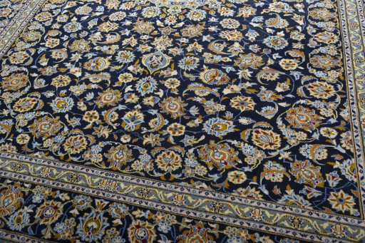 Close-up detail of 2000s Kashan rug from Iran / Persia showing Wool weave