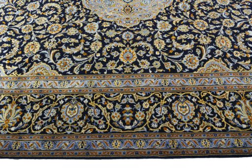 Corner detail of 2000s Kashan rug showing border pattern and Wool pile