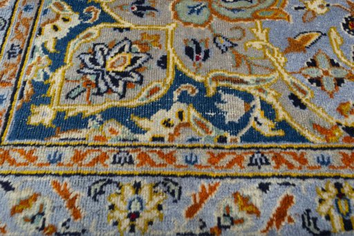 Backside of handmade 2000s Kashan rug showing knot structure and weave density