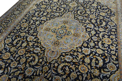 Backside of handmade 2000s Kashan rug showing knot structure and weave density