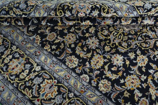 Close-up detail of 2000s Kashan rug from Iran / Persia showing Wool weave