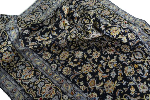 Surface texture of 2000s Kashan rug with natural Wool and intricate pattern