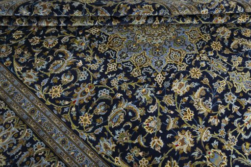 Close-up detail of 2000s Kashan rug from Iran / Persia showing Wool weave