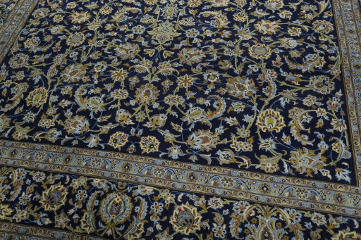Close-up detail of 2000s Kashan rug from Iran / Persia showing Wool weave