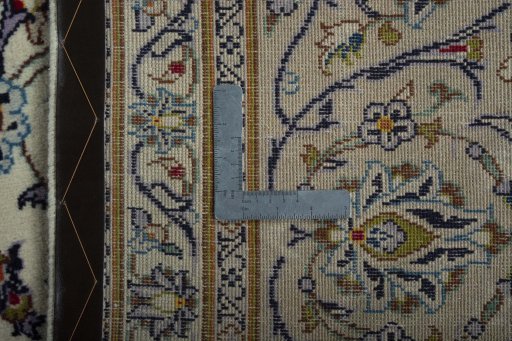 Backside of handmade 2000s Kashan rug showing knot structure and weave density