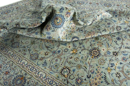 Surface texture of 2000s Kashan rug with natural Wool and intricate pattern