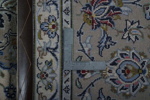 Backside of handmade 2000s Kashan rug showing knot structure and weave density