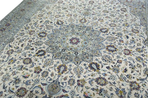 Backside of handmade 2000s Kashan rug showing knot structure and weave density