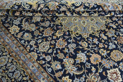 Close-up detail of 2000s Kashan rug from Iran / Persia showing Wool weave