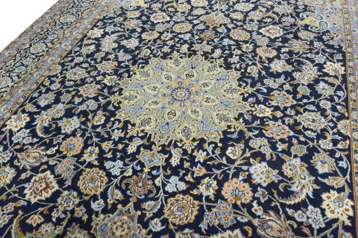Backside of handmade 2000s Kashan rug showing knot structure and weave density