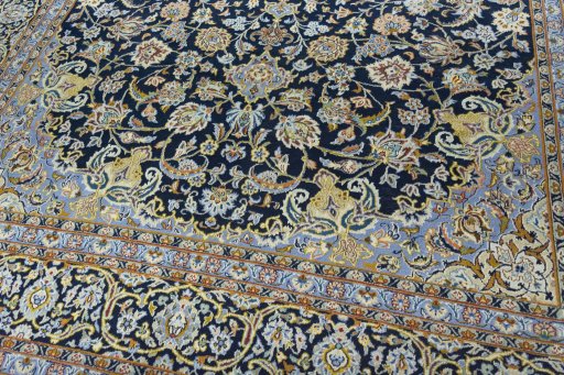 Close-up detail of 2000s Kashan rug from Iran / Persia showing Wool weave