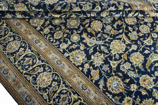 Close-up detail of 2000s Kashan rug from Iran / Persia showing Wool weave