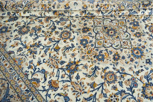 Close-up detail of 2000s Kashan rug from Iran / Persia showing Wool weave