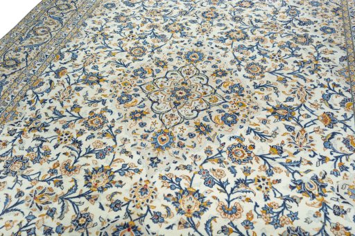 Backside of handmade 2000s Kashan rug showing knot structure and weave density