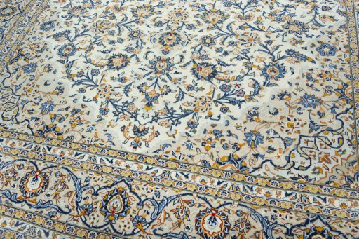 Close-up detail of 2000s Kashan rug from Iran / Persia showing Wool weave
