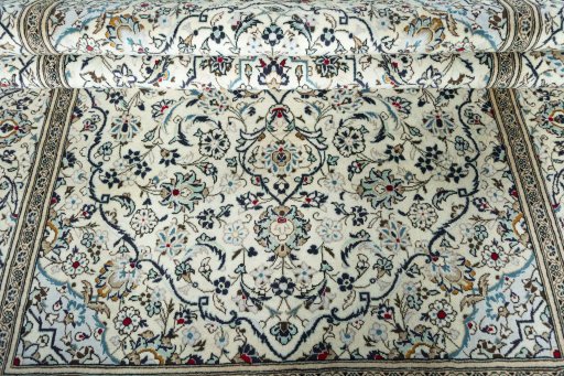 Close-up detail of 2000s Kashan rug from Iran / Persia showing Wool weave