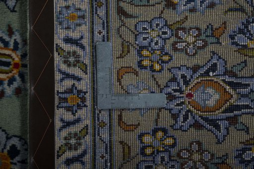 Backside of handmade 2000s Kashan rug showing knot structure and weave density