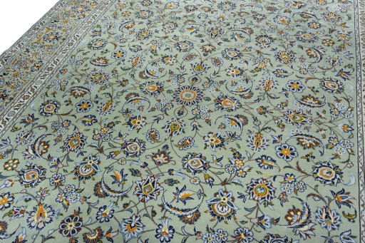Backside of handmade 2000s Kashan rug showing knot structure and weave density
