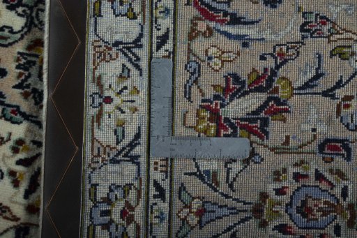 Backside of handmade 2000s Kashan rug showing knot structure and weave density