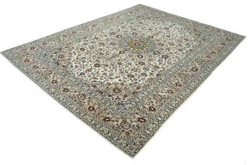 Corner detail of 2000s Kashan rug showing border pattern and Cork pile