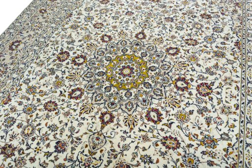 Backside of handmade 2000s Kashan rug showing knot structure and weave density